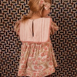 We love the beautiful collar of our Clémence blouse, featuring an elongated design adorned with delicate ladder lace at the back, and exquisite hand embroidery with elegant lace trim at the front.

Pic by @manuelafranjouphoto 

#bachaa #paris #collar #kidfashion