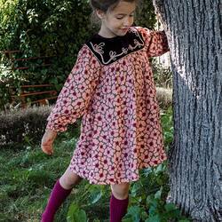 This is our AMALIA dress. 
A dress in ECOVERO® Viscose with golden hand embroideries on a velvet collar.

📷 @mesenfantssauvages 

#kidsfashion #velvet #blockprinting #handembroidery